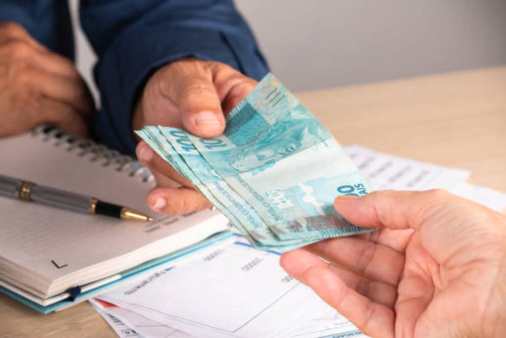 businessman giving money to his partner when making contract business and finance concept